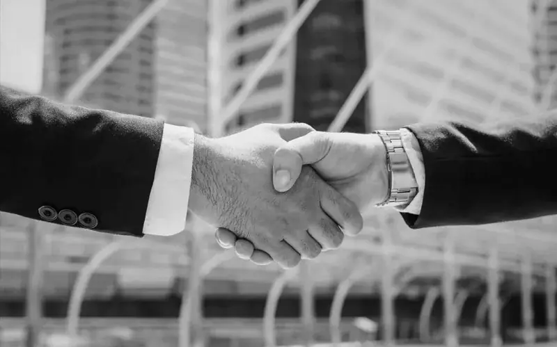 Business partners shaking hands on an agreement